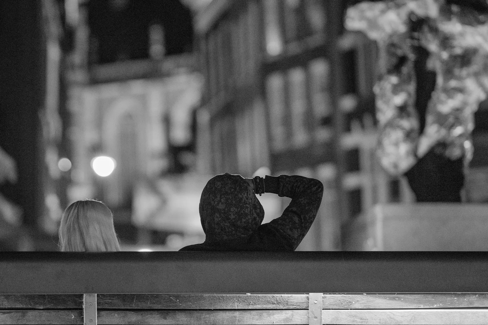 Amsterdam at night, passers-by on a lit quay